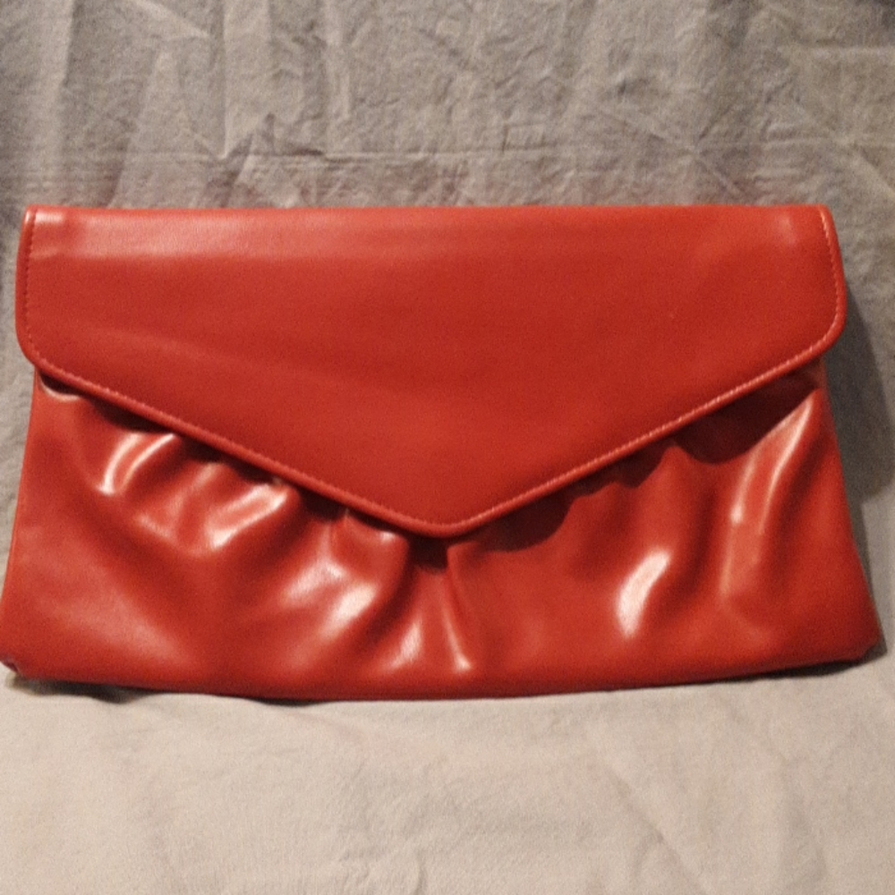 Red hand bag with pull out strap
